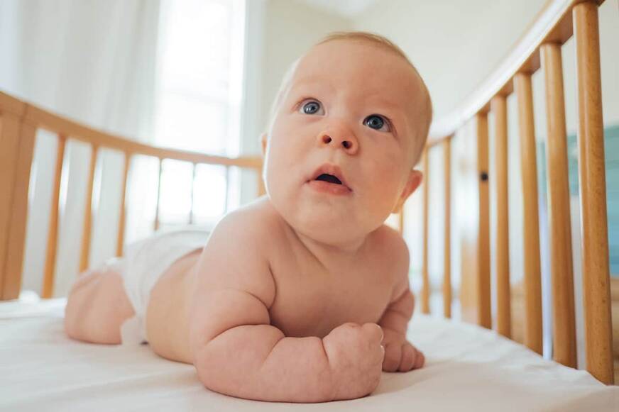 Baby in cot